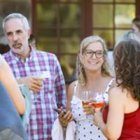 Faculty outside chatting